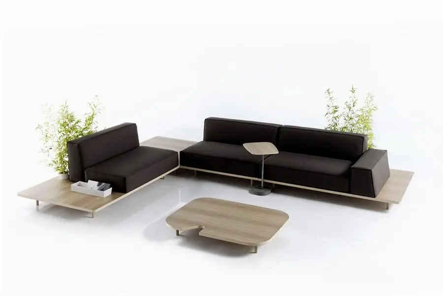 Low black reception sofa with side tables